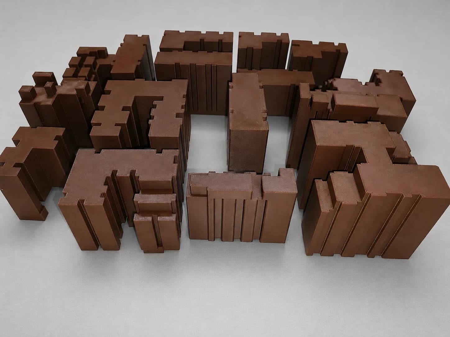 Mass model building volumes pushed together into an urban block with courtyards and gaps between buildings