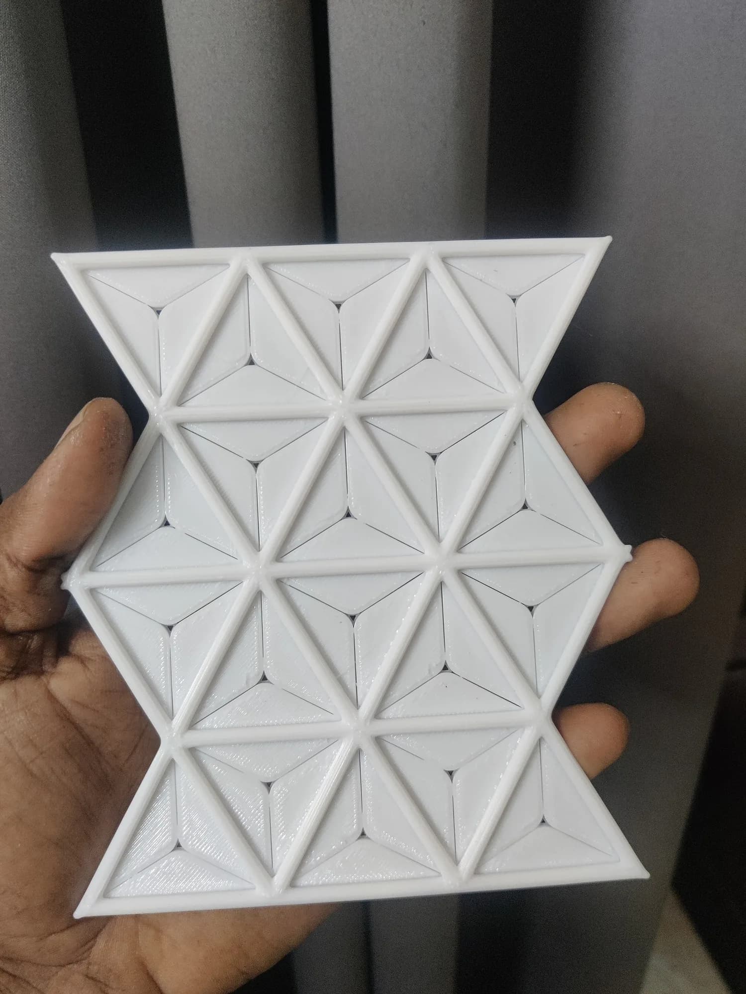3D printed asanoha-style panel with the fins lying nearly flat, forming a closed geometric surface