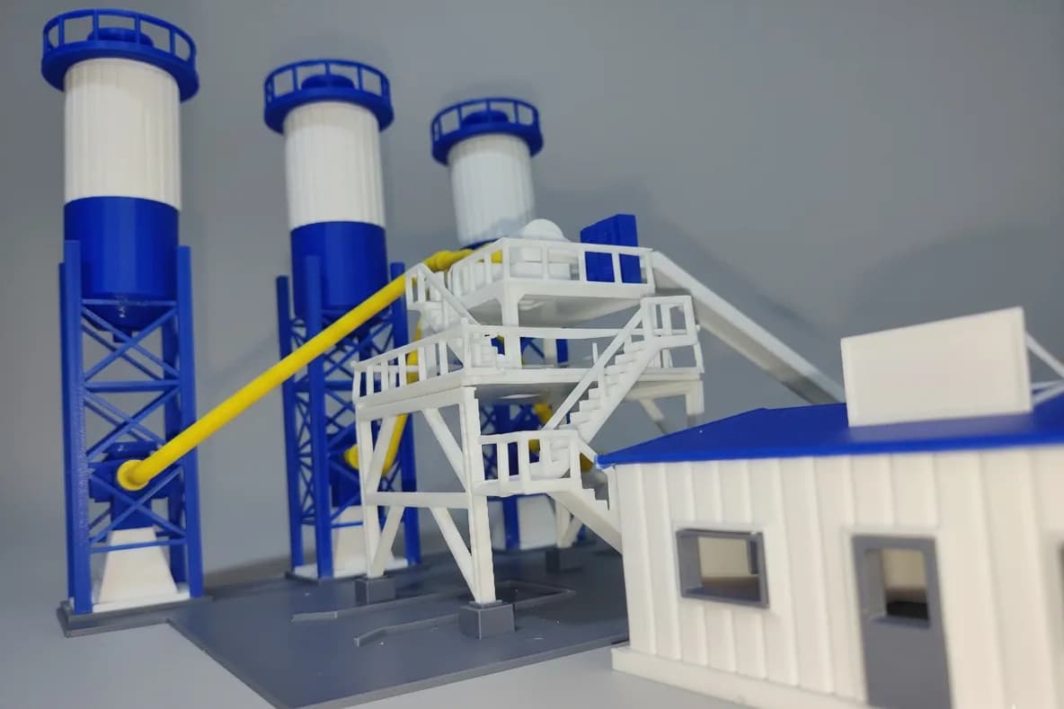 Mixer tower of the batching plant model with stairs, handrails and the inclined conveyor behind the site office