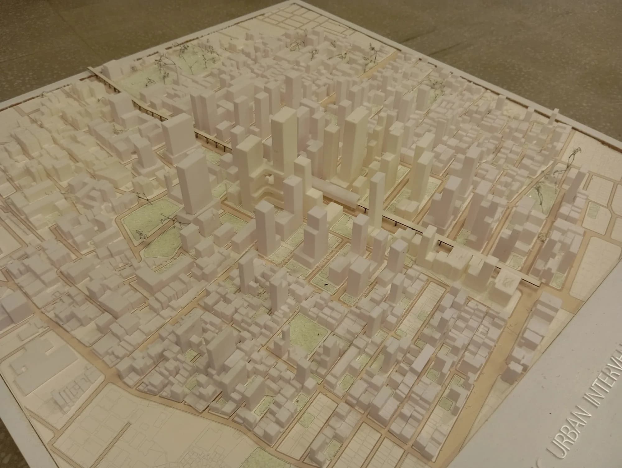 Overview of the urban model base with its street network, parks and plots, with URBAN INTERVENTION lettering on the frame
