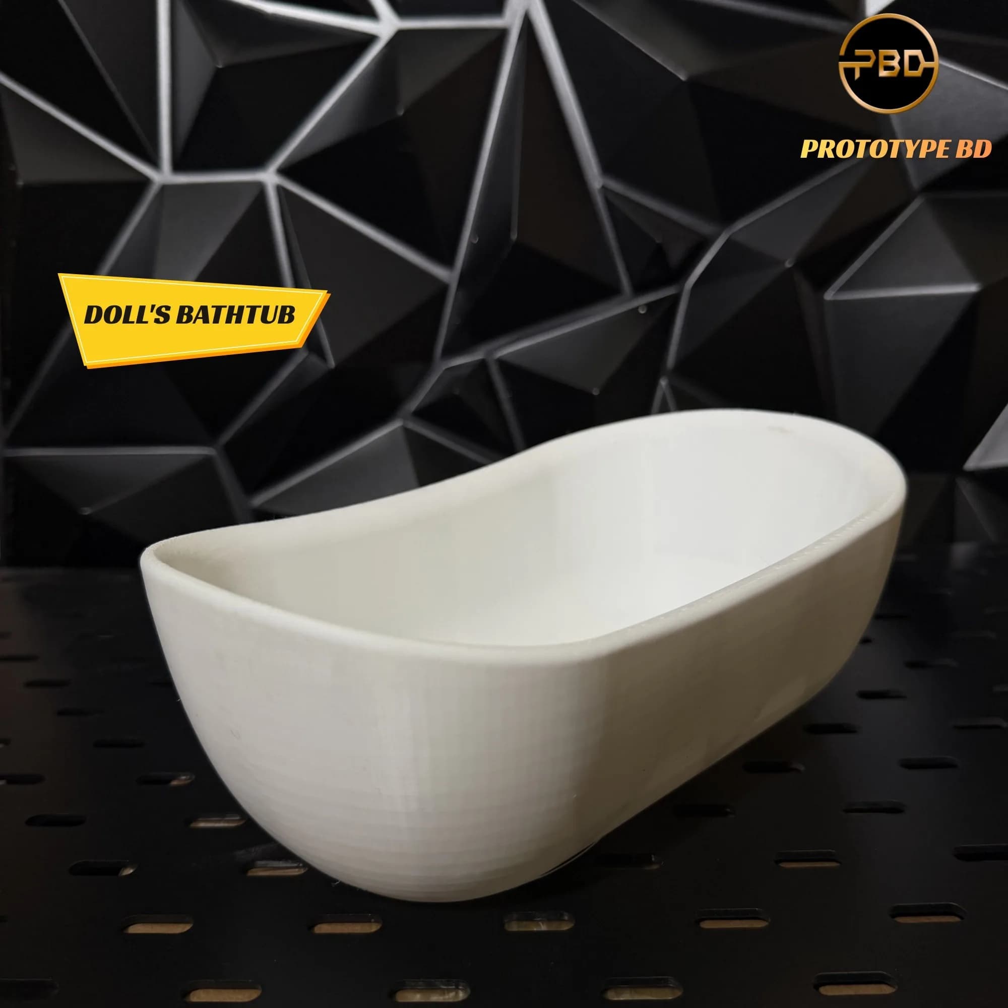 White 3D printed doll's bathtub on a black pegboard shelf