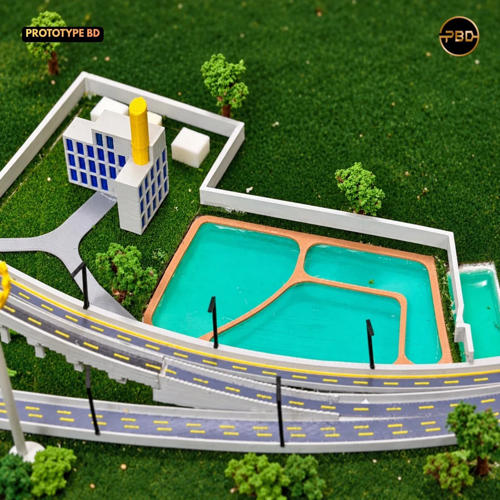 Service building with ponds and a boundary wall beside the highway in the Hatikamrul Interchange scale model