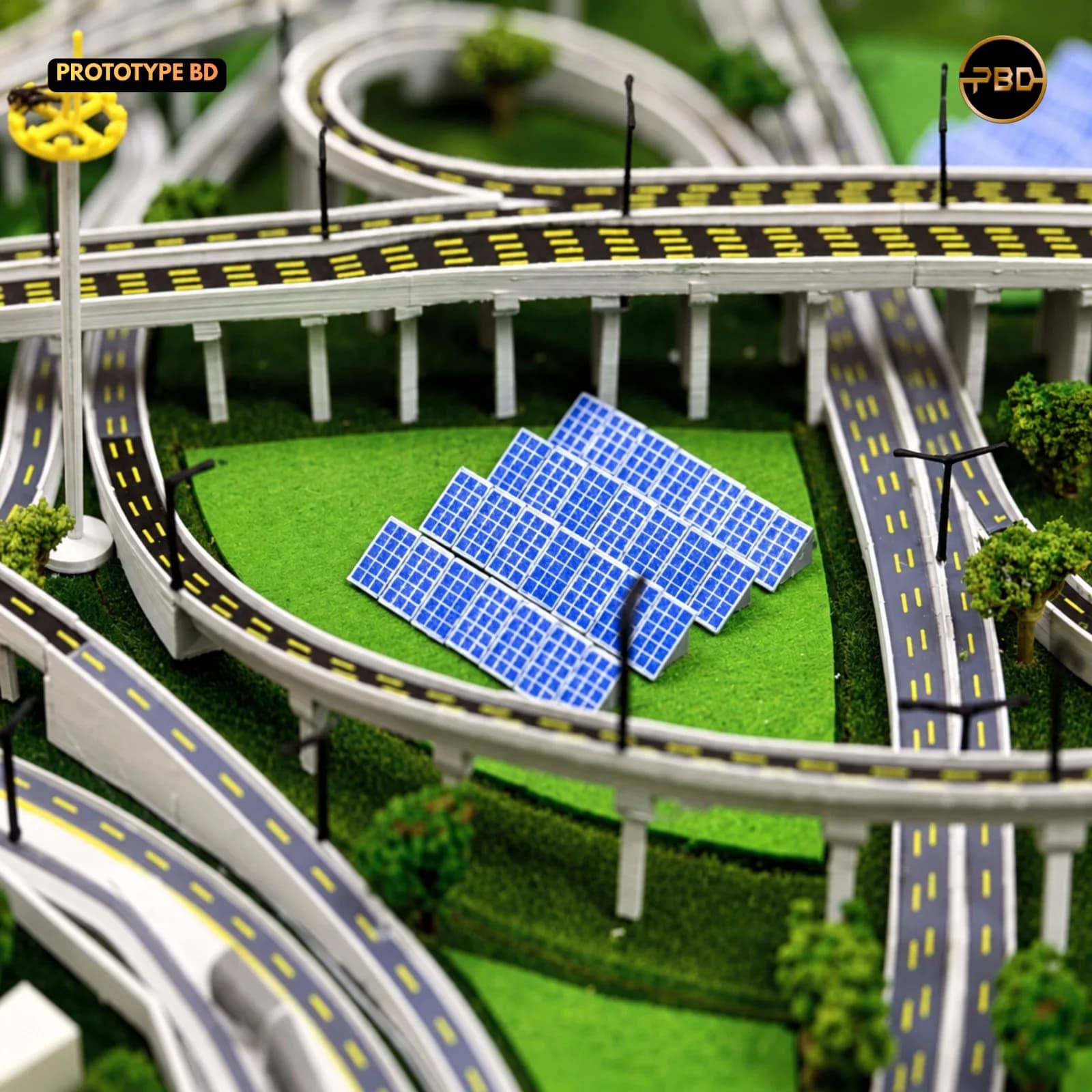 Solar panel array on a green island under the curved flyovers of the Hatikamrul Interchange model