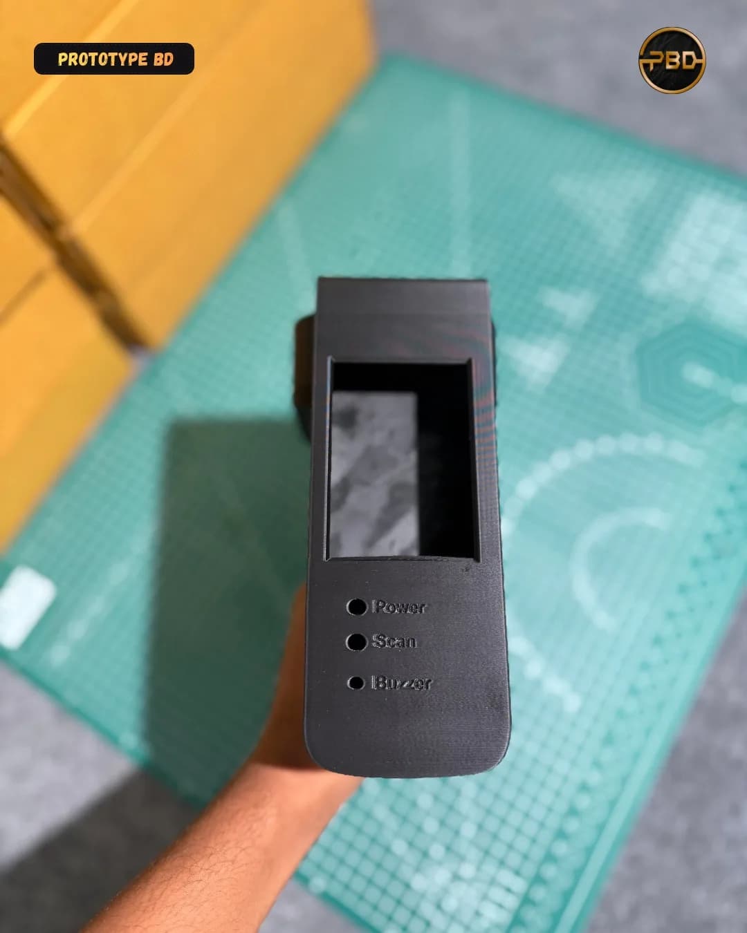 Top of the 3D printed enclosure with the display opening and indicator holes labelled Power, Scan and Buzzer