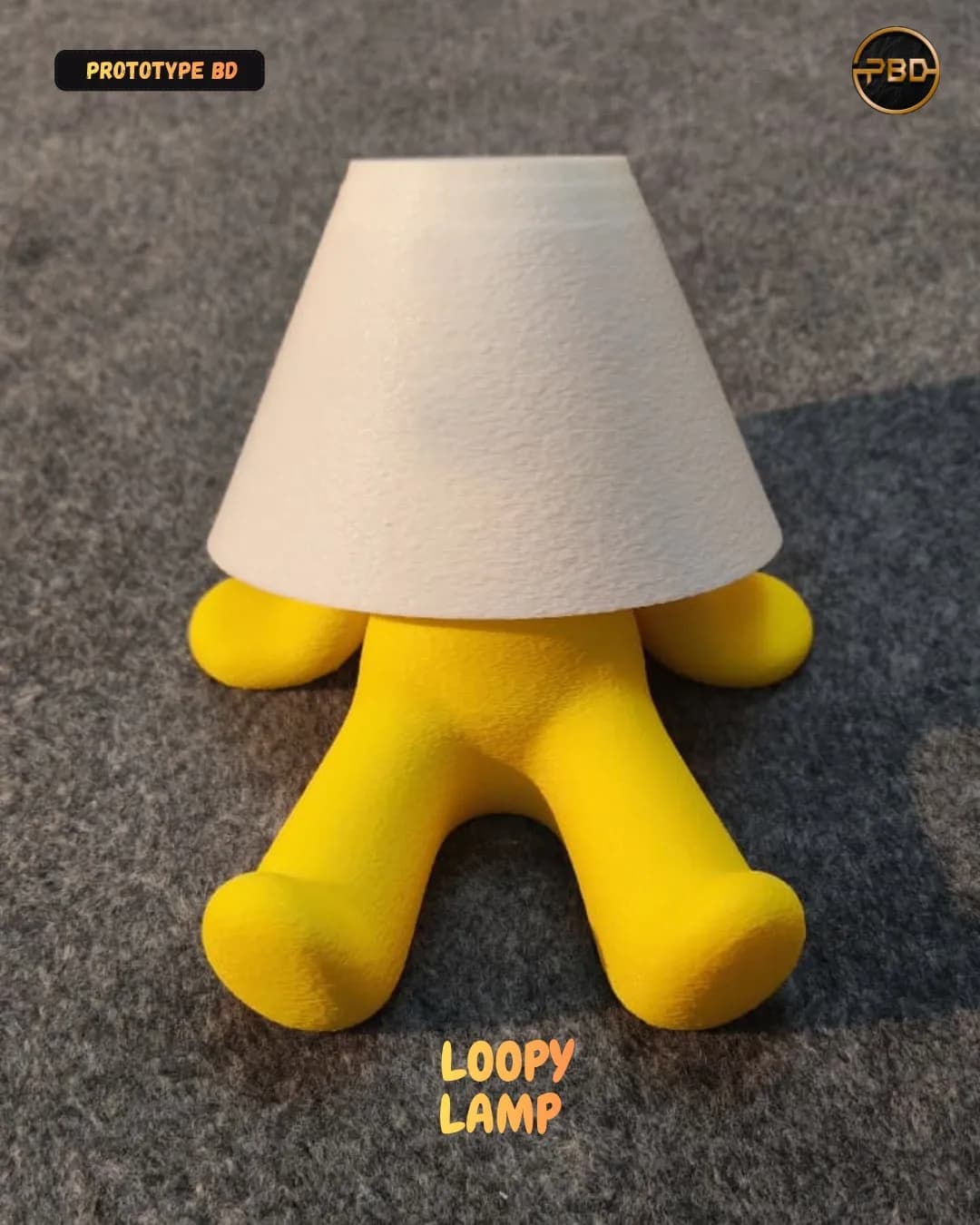Yellow Loopy Lamp body with a white textured shade, seen from the front on a grey carpet