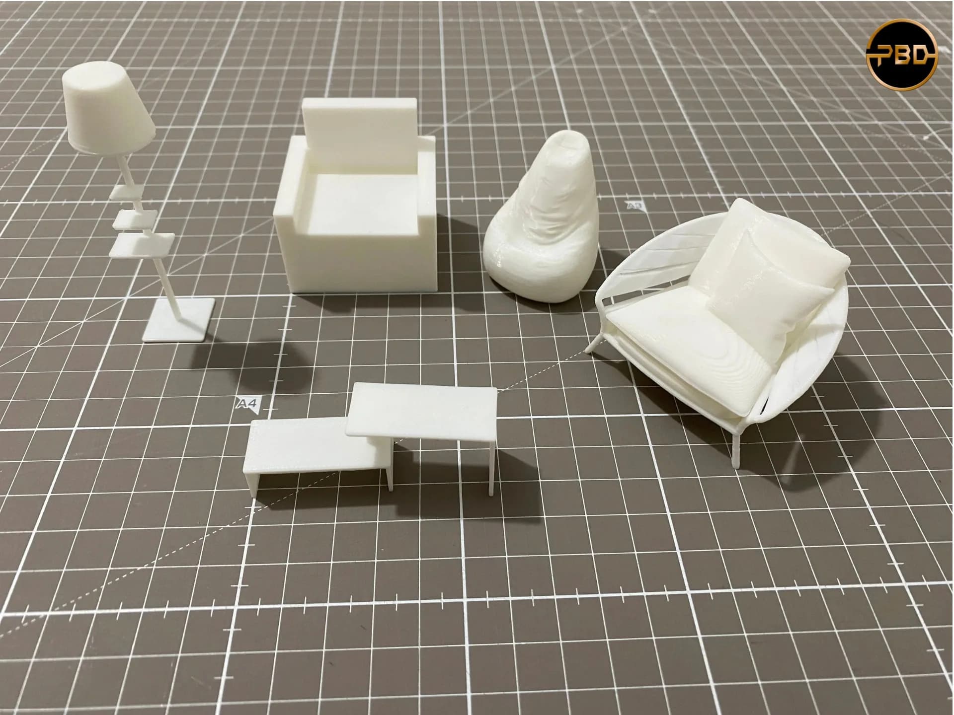 Miniature box armchair, bean bag, lounge chair with cushion, floor lamp and two low tables, 3D printed in white
