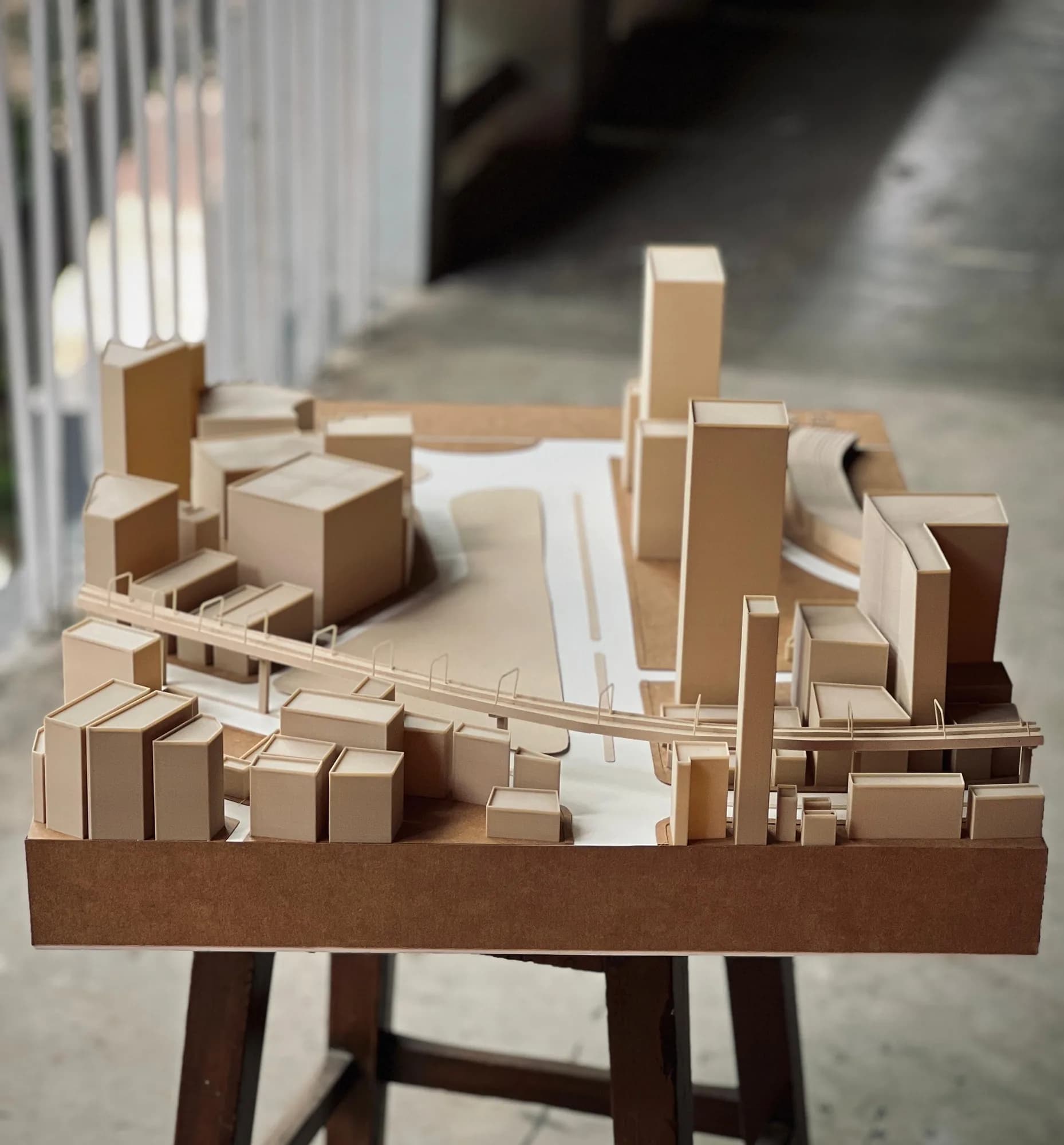 Rear view of the site model on a wooden stand with the footbridge running across the front