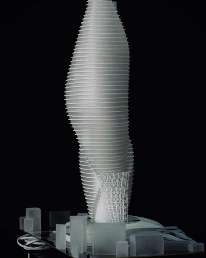 Close-up of the tower model's thin floor plates curving upward above the context blocks
