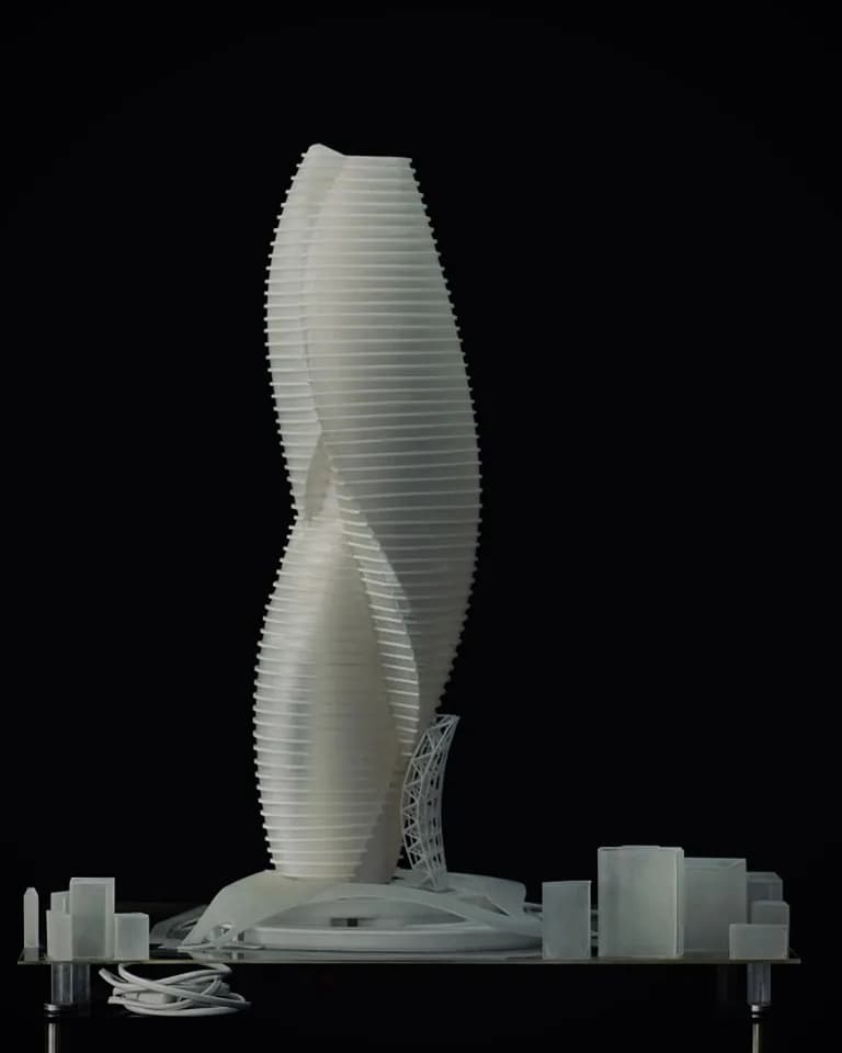 Side view of the Myofascial Rise tower model showing the two twisting volumes and the lattice at the base