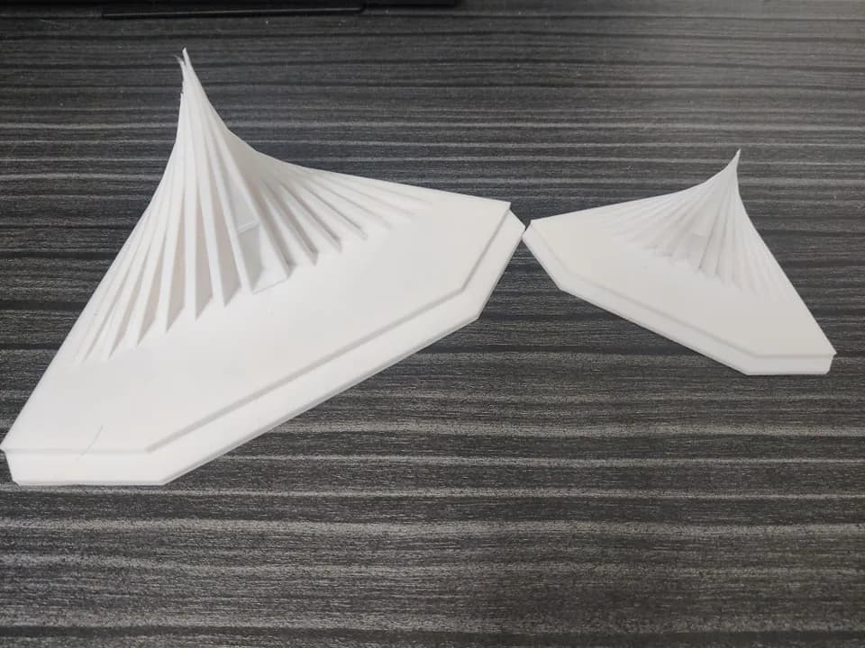 Two National Memorial miniatures in different sizes side by side on a desk