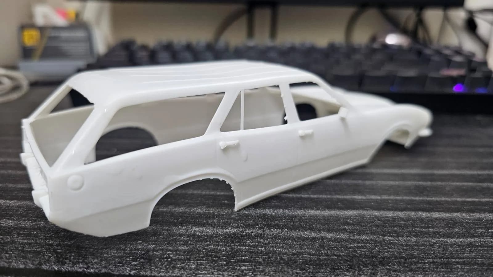 Rear three-quarter view of the resin station wagon shell showing the long roof and rear wheel arch